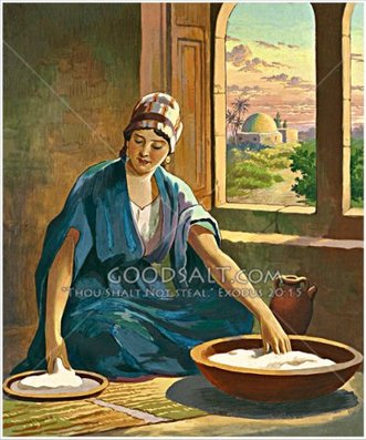 Frau durchsaeuert Brot